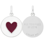 A Lola heart-shaped pendant in cranberry red. Available at Be Charmed