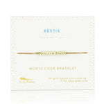Lucky Feather Bestie Morse Code Bracelet on card featuring a gold-dipped bar engraved with 'Bestie' in Morse code, on an adjustable cord. Available at Be Charmed.