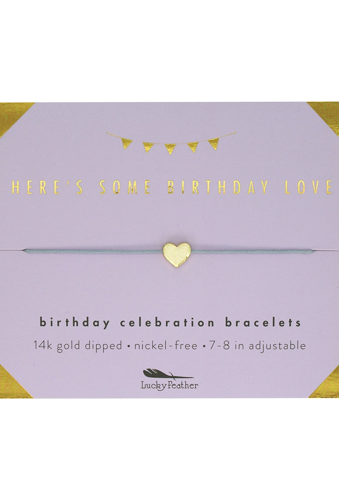 Gold bracelet on a purple card with text about birthday celebration bracelets. Available at Be Charmed
