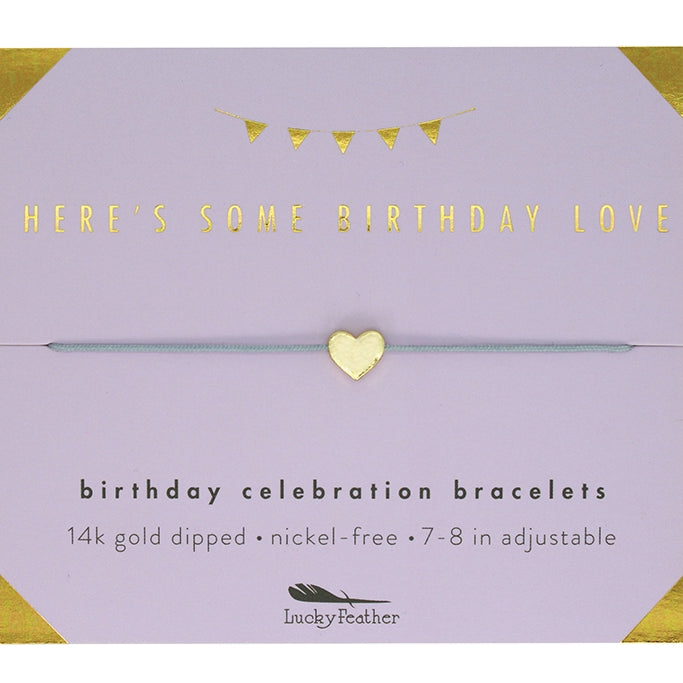 Gold bracelet on a purple card with text about birthday celebration bracelets. Available at Be Charmed