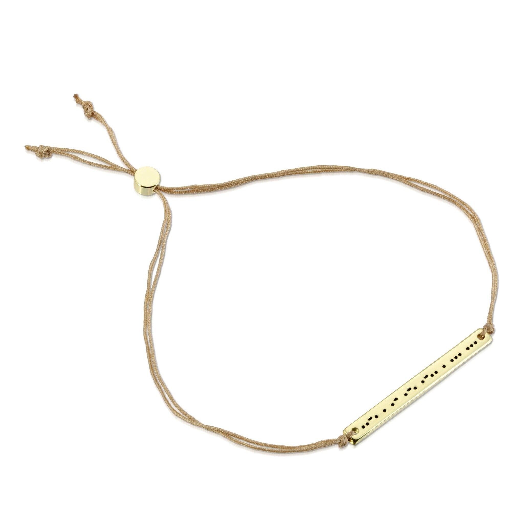 Lucky Feather Fearless Morse Code Bracelet featuring a gold-dipped bar engraved with 'Fearless' in Morse code, on an adjustable cord. Available at Be Charmed.