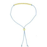 Lucky Feather Fun Twenty-One Milestone Birthday Bracelet featuring 21 gold-dipped beads on an adjustable cord, symbolizing each year. Available at Be Charmed.