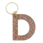 Lucky Feather Initial D Keychain featuring glittery acrylic letter charm with gold-tone hardware, personalized for each letter. Available at Be Charmed.