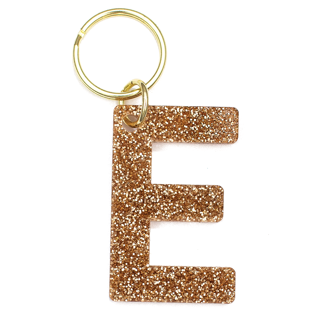 Lucky Feather Initial E Keychain featuring glittery acrylic letter charm with gold-tone hardware, personalized for each letter. Available at Be Charmed.