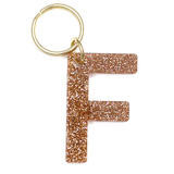 Lucky Feather Initial F Keychain featuring glittery acrylic letter charm with gold-tone hardware, personalized for each letter. Available at Be Charmed.