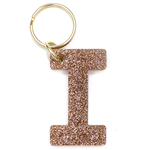 Lucky Feather Initial I Keychain featuring glittery acrylic letter charm with gold-tone hardware, personalized for each letter. Available at Be Charmed.