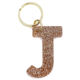 Lucky Feather Initial J Keychain featuring glittery acrylic letter charm with gold-tone hardware, personalized for each letter. Available at Be Charmed.