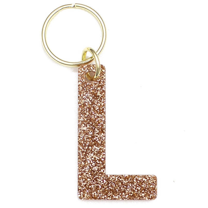 Lucky Feather Initial L Keychain featuring glittery acrylic letter charm with gold-tone hardware, personalized for each letter. Available at Be Charmed.