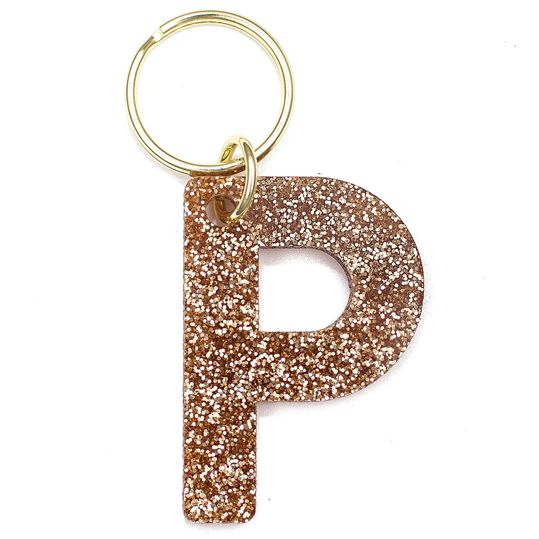 Lucky Feather Initial P Keychain featuring glittery acrylic letter charm with gold-tone hardware, personalized for each letter. Available at Be Charmed.