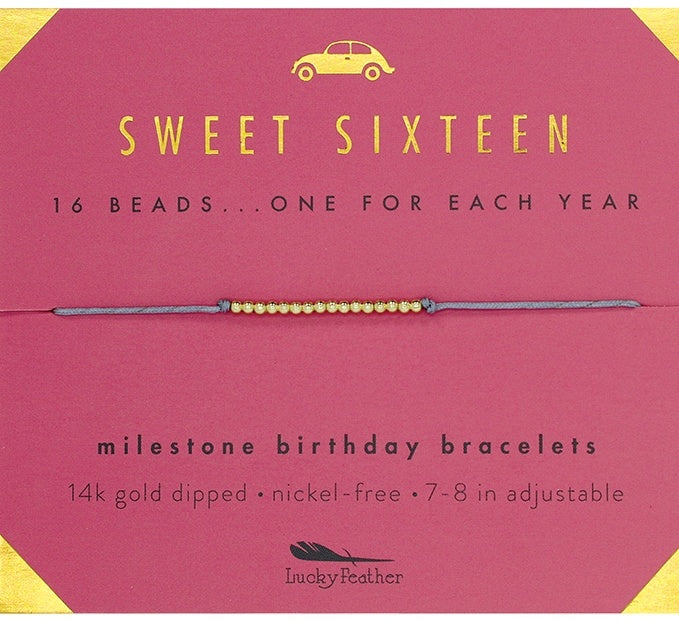 Lucky Feather Sweet Sixteen Milestone Birthday Bracelet on card featuring 16 gold-dipped beads on an adjustable cord, symbolizing each year. Available at Be Charmed.