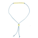 Lucky Feather Sweet Sixteen Milestone Birthday Bracelet featuring 16 gold-dipped beads on an adjustable cord, symbolizing each year. Available at Be Charmed.