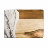 Wooden cutting board with marble pattern on a white background. Available at Be Charmed