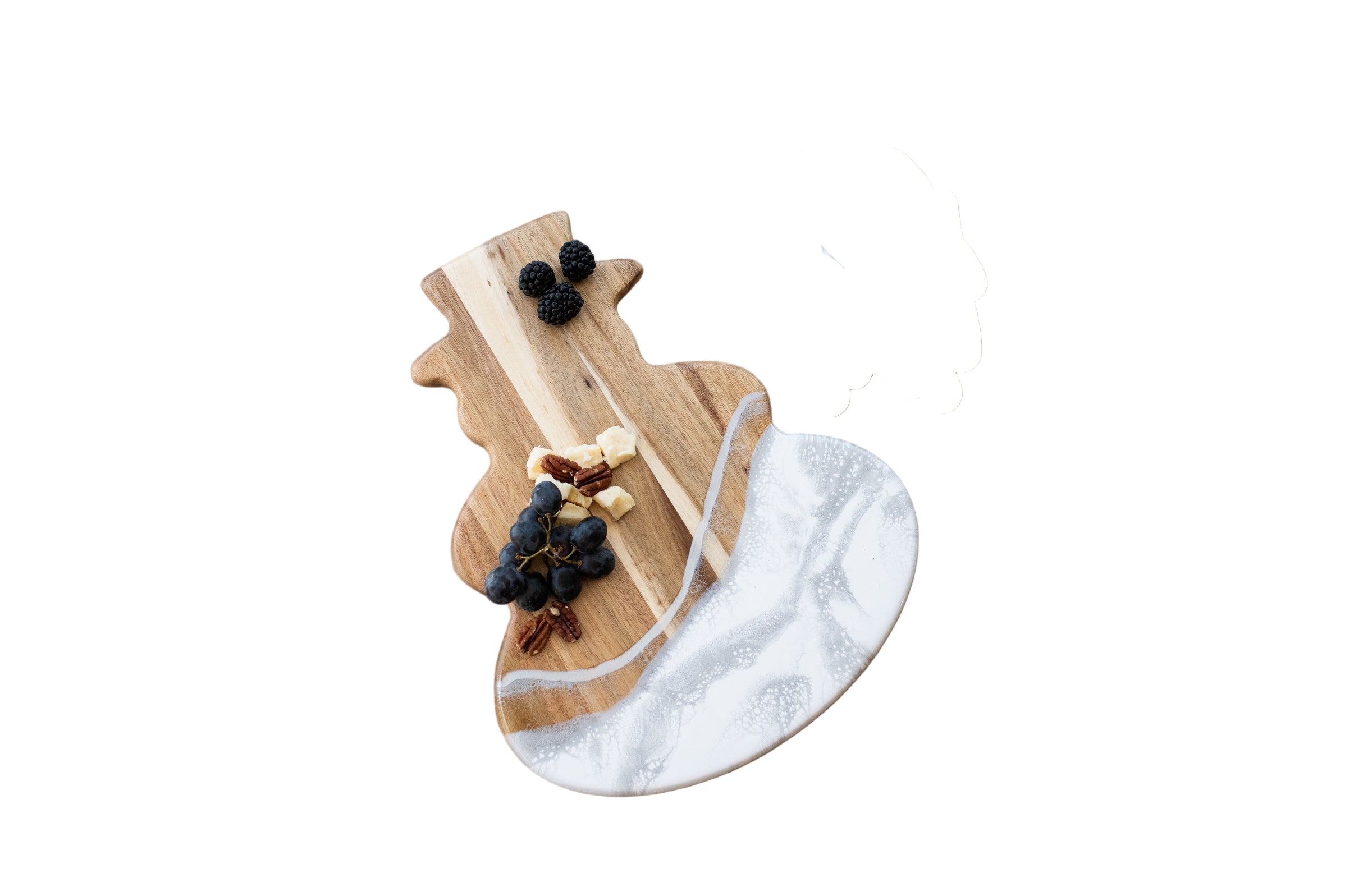 Lynn & Liana "Let it Snow" Charcuterie Board in Tinsel—festive hand-poured silver and white resin with engraved holiday message. Available at Be Charmed.