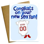 Greeting card with baby onesie illustration and text 'Congrats on your new SOX Fan!' on a light blue background. Available at Be Charmed