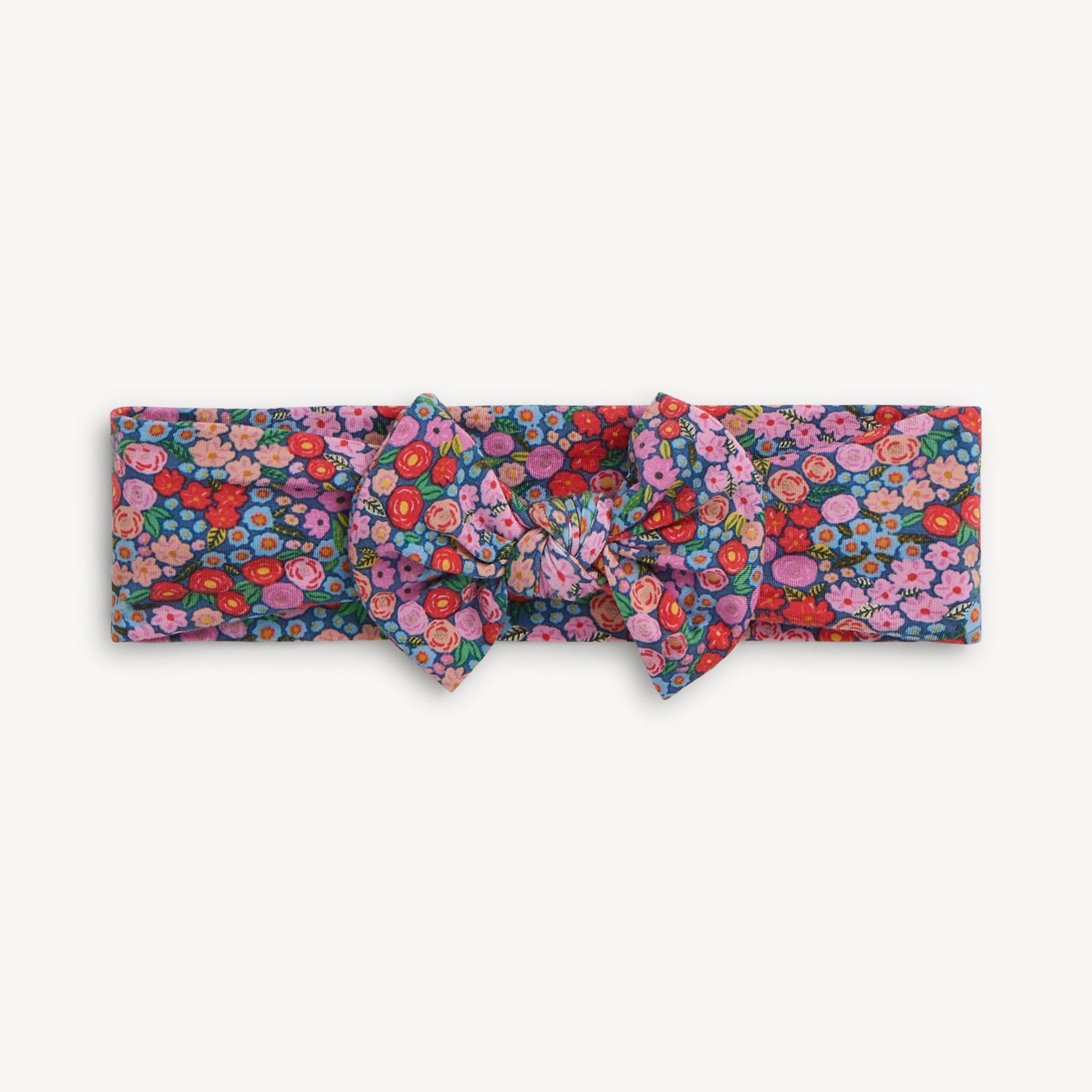 Magnetic Me Gilded Lily Floral patterned headband on a white background. Available at Be Charmed