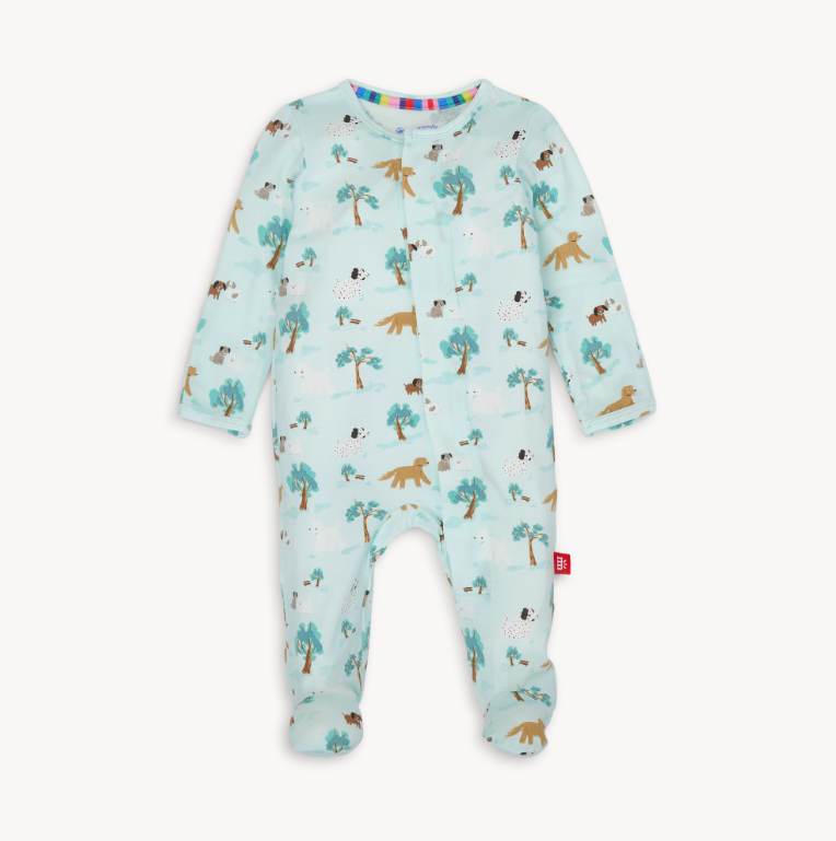 Magnetic Me Central Bark Modal Footie featuring a playful dog print on a soft blue background, designed for easy dressing. Available at Be Charmed.