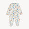 Magnetic Me Footie in Bach & Roll – ultra-soft baby footie with magnetic closures for easy changes, featuring a playful musical print, made with eco-friendly modal fabric, available at Be Charmed.