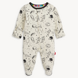 Magnetic Me baby footie in Natural Game Day print with sports icons. Soft modal fabric with magnetic closures for easy dressing. Available at Be Charmed.