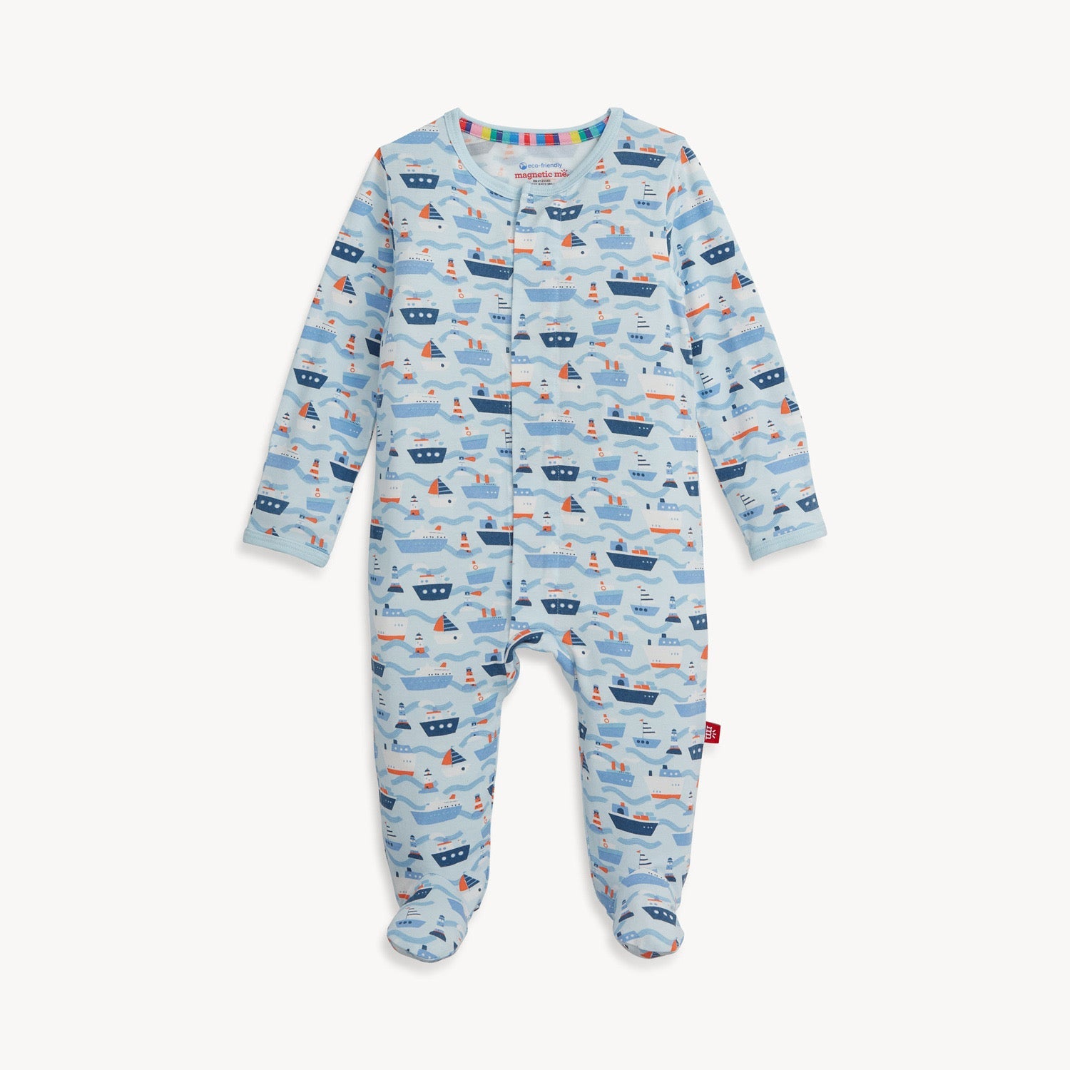 A blue Magnetic Me baby footie with a pattern of boats and waves, featuring magnetic closures. Available at Be Charmed