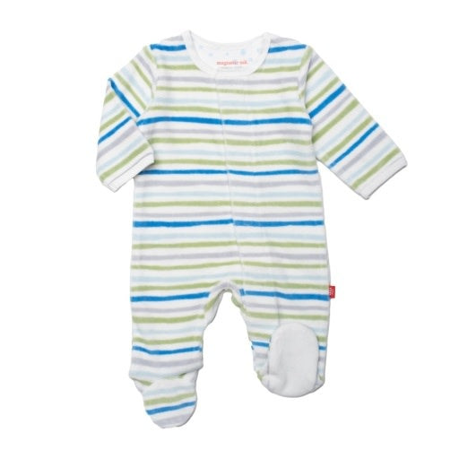 A baby Magnetic Me footie with multi-colored stripes and a brand tag visible on the lower side. Available at Be Charmed