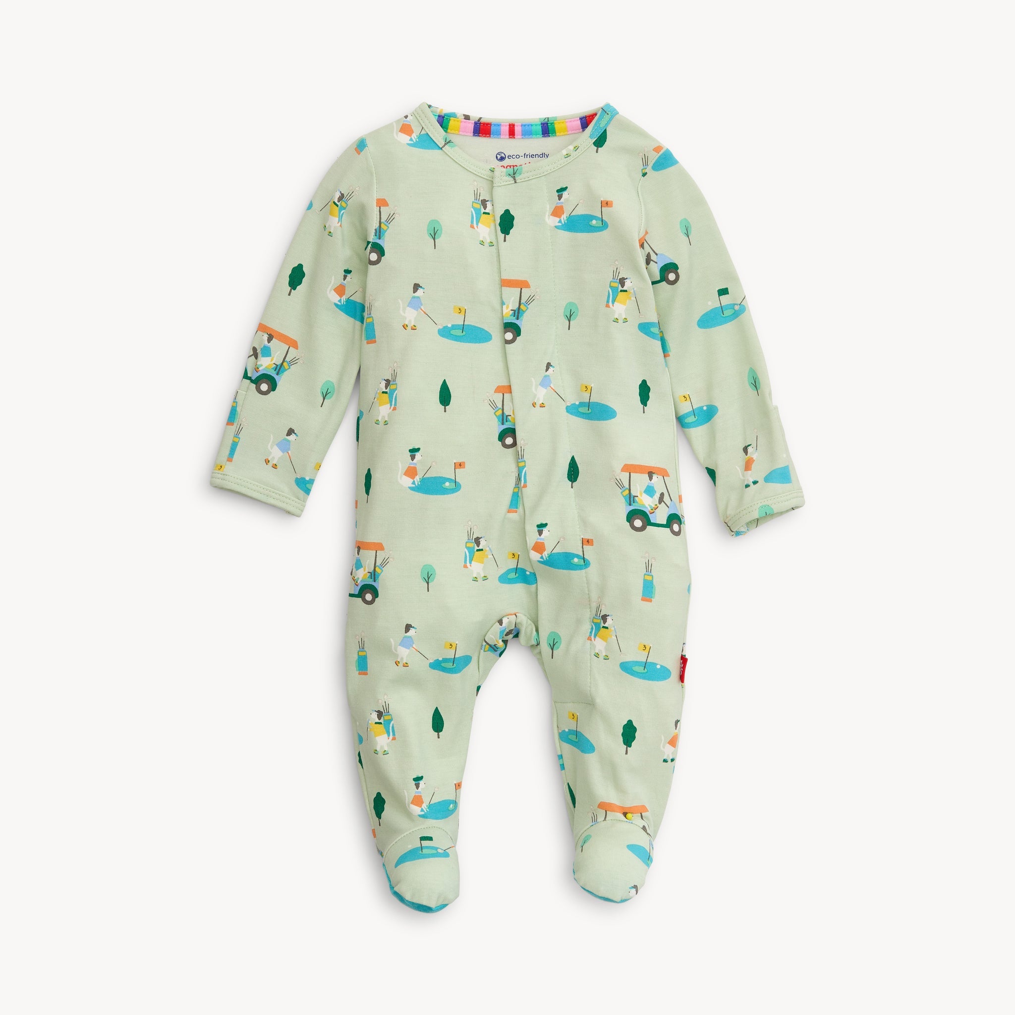 This image features the "Magnetic Me - Modal Footie - Fairway Fetch," a charming and practical baby footie. It is designed with an adorable fairway and golf-themed print in a light green background, adding a playful and whimsical touch. Available at Be Charmed