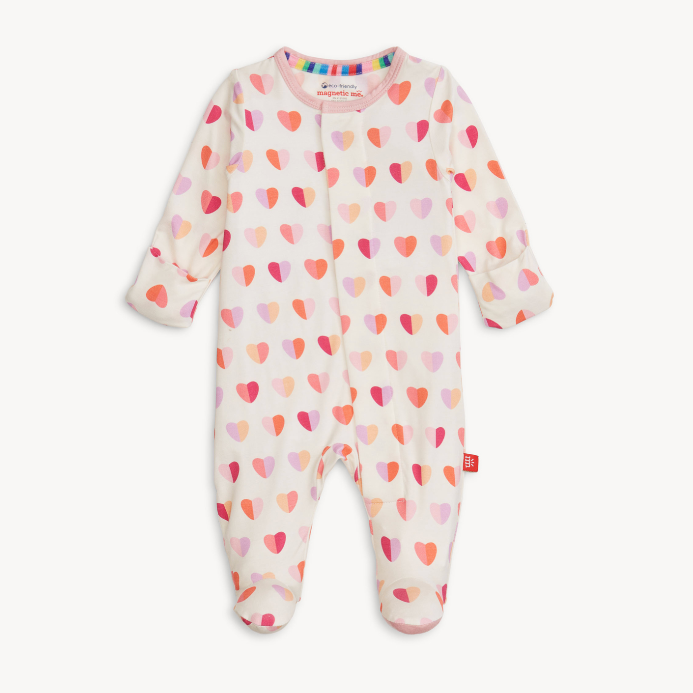 Magnetic Me Baby footie with heart pattern on a white background. Be Charmed