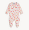Magnetic Me Baby footie with heart pattern on a white background. Be Charmed
