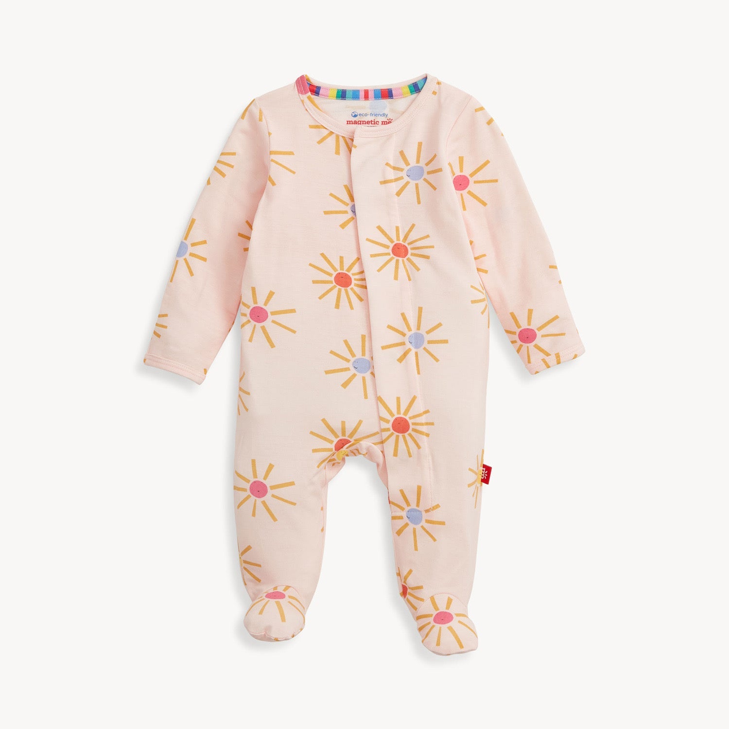 A pink baby footie with a sunflower pattern and magnetic closures, displayed against a white background. Available at Be Charmed