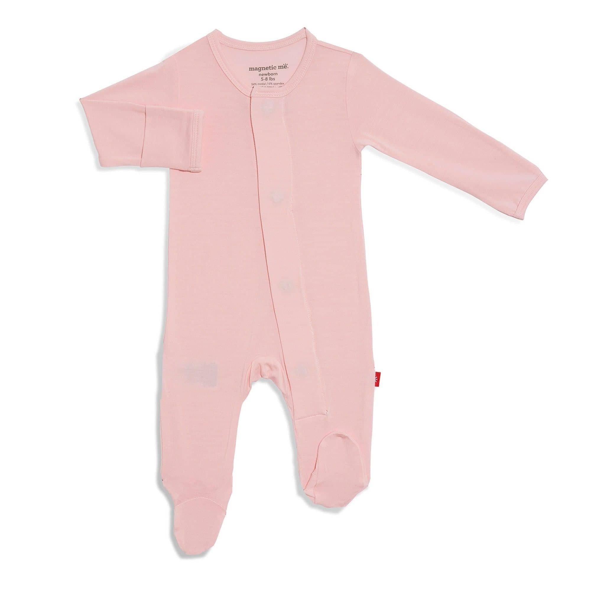 A pink dogwood Magnetic Me modal footie for babies with magnetic closures, visible from the neck to upper thigh. Available at Be Charmed
