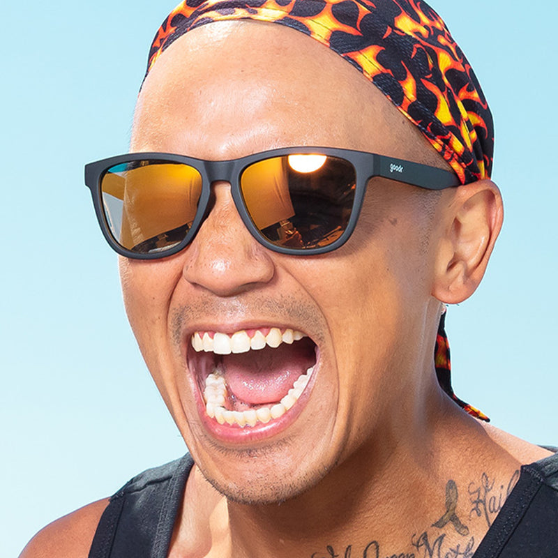 Man Wearing Goodr Whiskey Shots With Satan Sunglasses. Available at Be Charmed