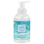 Foaming hand wash bottle with ocean-themed label on a white background. Available at Be Charmed