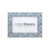Decorative picture frame with blue geometric pattern and 'color theory imagined by Mariposa' text. Available at Be Charmed. 