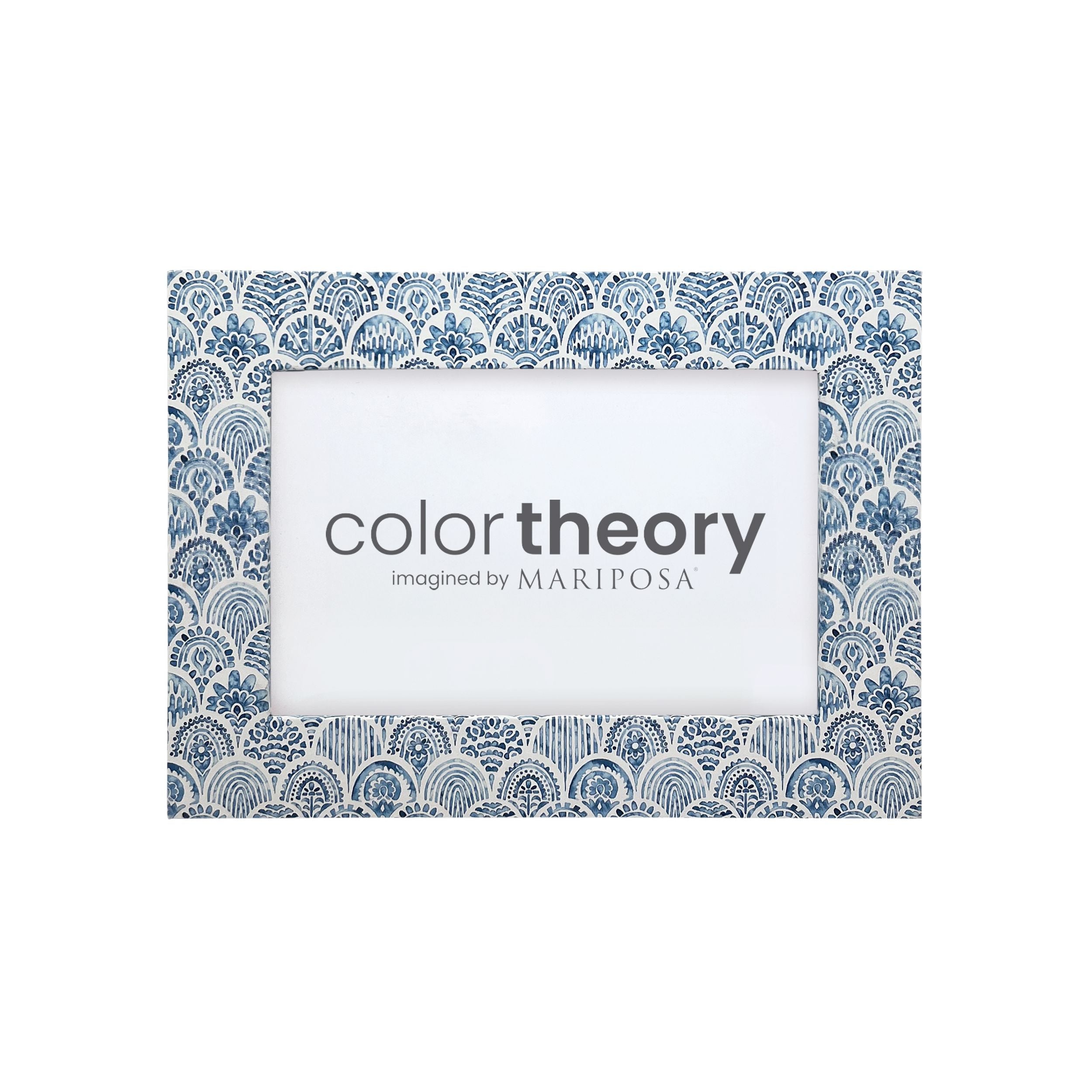 Decorative picture frame with blue geometric pattern and 'color theory imagined by Mariposa' text. Available at Be Charmed. 