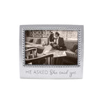 A 4x6 beaded picture frame with an engraved quote 'He asked. She said Yes.' Available at Be Charmed