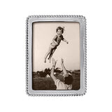 A silver-colored Mariposa beaded picture frame with a 5x7 aspect ratio, displaying a photograph of a child being lifted into the air by an adult. Available at Be Charmed