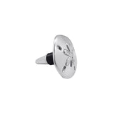 Decorative metal bottle stopper with sand dollar design on a white background. Available at Be Charmed