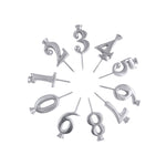 A set of 10 aluminum candle holders with numbers 1-10 printed on them, displayed in a circular pattern. Available at Be Charmed