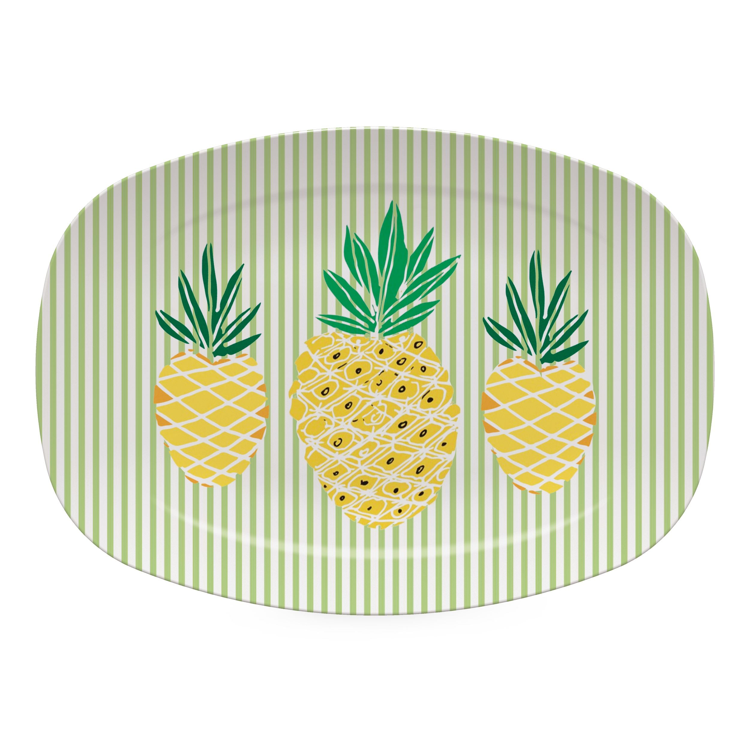 Melamine plate with pineapple design on a green striped background. Available at BE Charmed