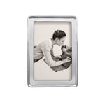 A silver aluminum 4x6 mariposa picture frame with an image of a mother and child. Available at Be Charmed