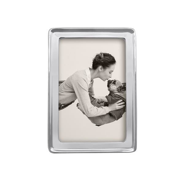 A silver aluminum 4x6 mariposa picture frame with an image of a mother and child. Available at Be Charmed