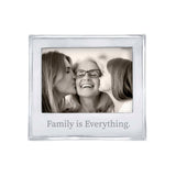 A 5x7 Mariposa picture frame with a quote 'Family is Everything' on the bottom, featuring an image of two adults and a child kissing cheeks. Available at Be Charmed