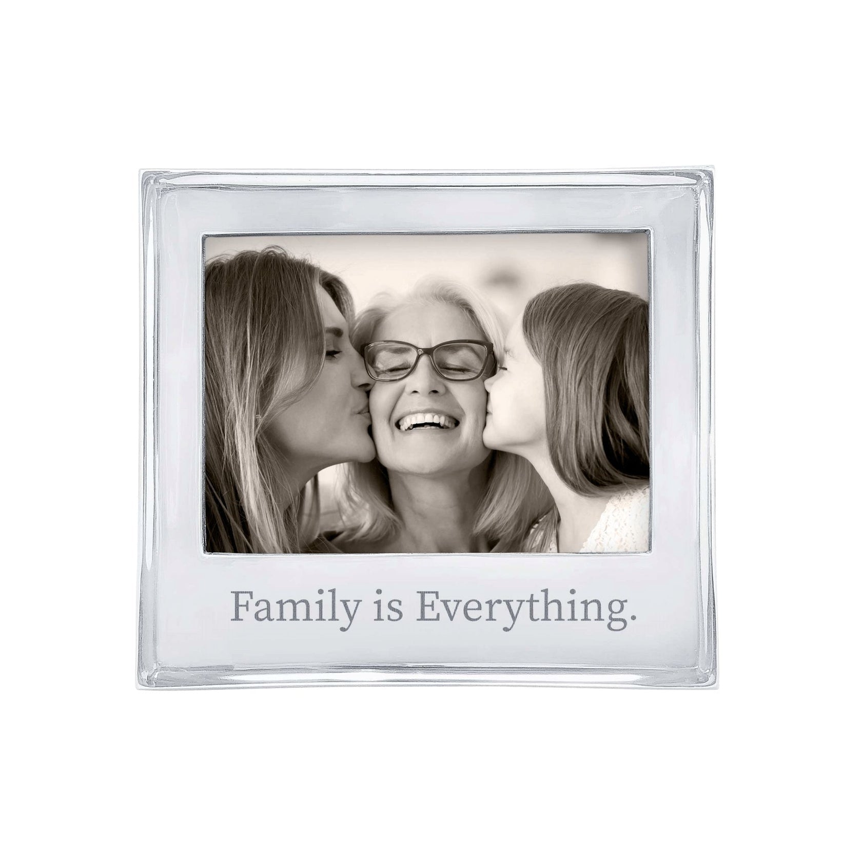 A 5x7 Mariposa picture frame with a quote 'Family is Everything' on the bottom, featuring an image of two adults and a child kissing cheeks. Available at Be Charmed