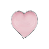 Heart-shaped pink trinket dish on a white background. Available at Be Charmed