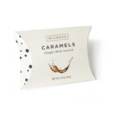 Individually wrapped caramels in a pillow box with 'McCrea's Candies Single Malt Scotch' branding and a net weight of 1.4 oz (397g). Available at Be Charmed