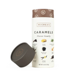 A 5.5oz tube of McCrea's caramel candies with the label showing different flavors such as chocolate, vanilla, birthday cake, and pumpkin spice. Available at Be Charmed