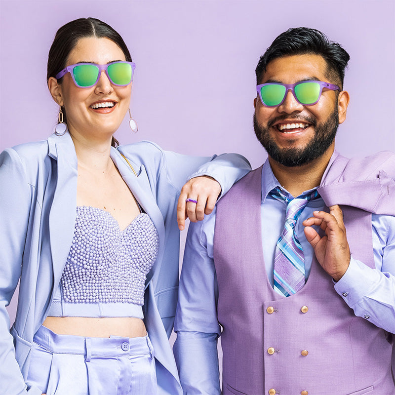 Men Wearing Lilac It Like That Goodr sunglasses with stylish purple frames, glare-reducing lenses, and no-slip grip—perfect for active wear; available at Be Charmed
