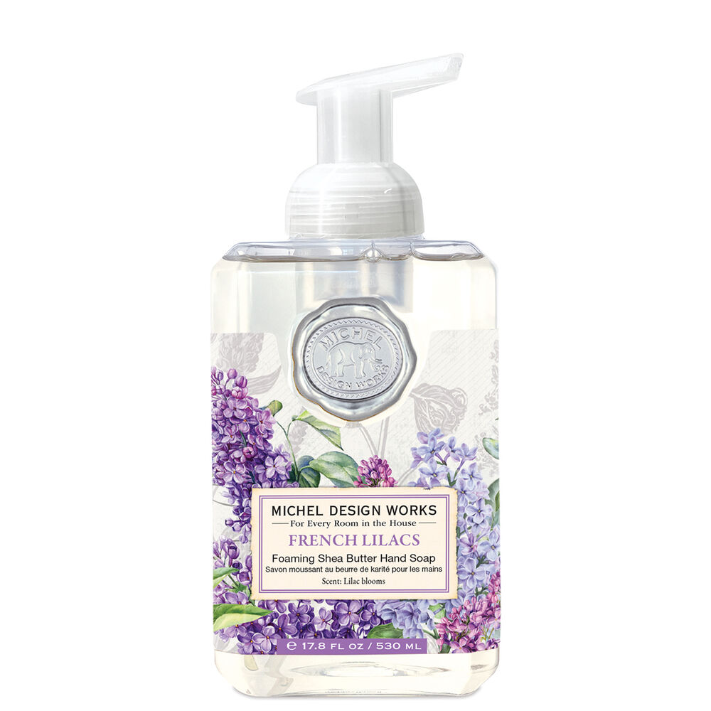 An elegant bottle of French Lilacs Michel Design Works foaming hand soap featuring decorative botanical artwork, available at Be Charmed.