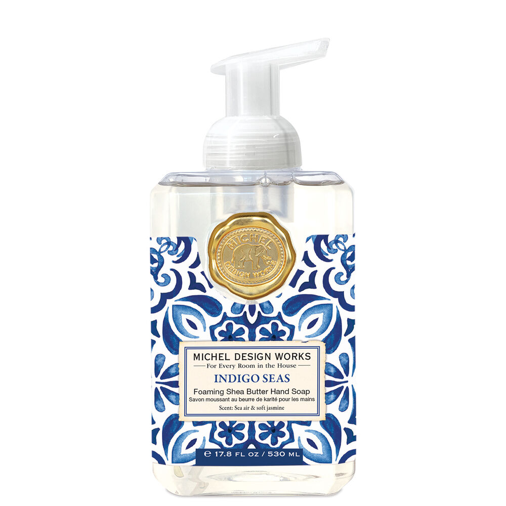 Foaming hand soap bottle with blue and white pattern and gold emblem on a white background. Available at Be Charmed