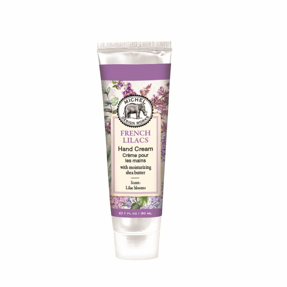 A compact 1 oz travel tube of French Lilacs Michel Design Works hand cream with vibrant botanical packaging, available at Be Charmed.