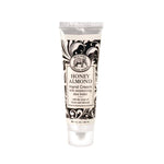 Tube of Honey Almond hand cream with decorative packaging on a white background. Available at Be Charmed